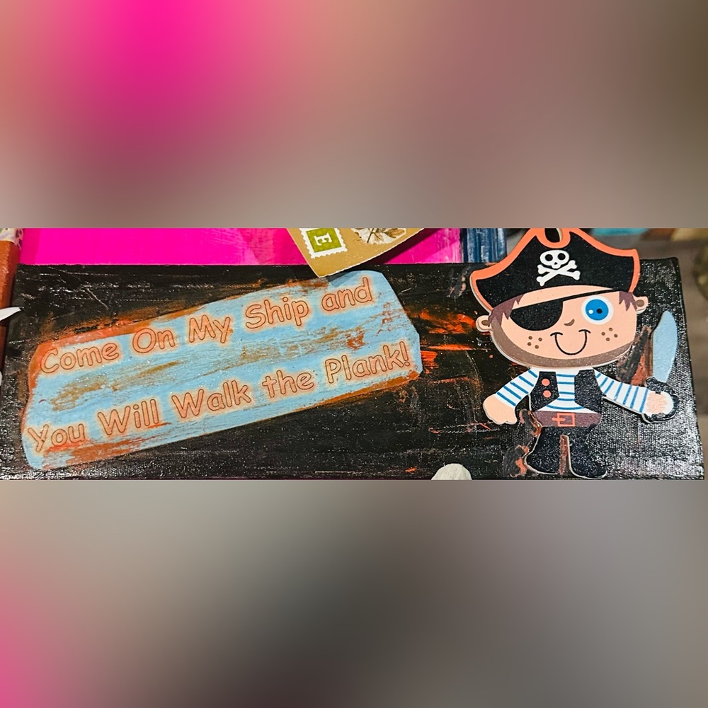 Pirate Themed Sign with Blue and Orange Text